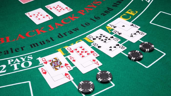 Blackjack table with cards and chips, representing probability and risk decisions